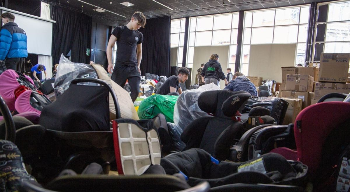 Students begin the task of sorting donations for Ukraine.